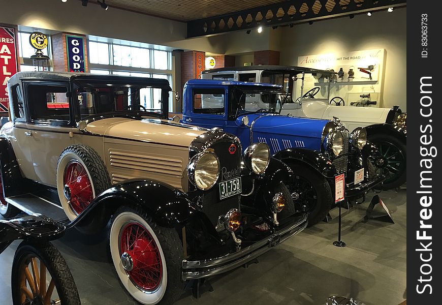 Assorted Vintage Cars in a Well Lighted Room