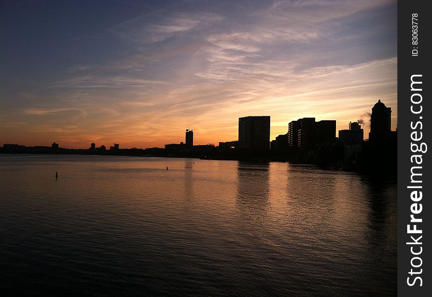 Boston skyline and harbour at dusk.