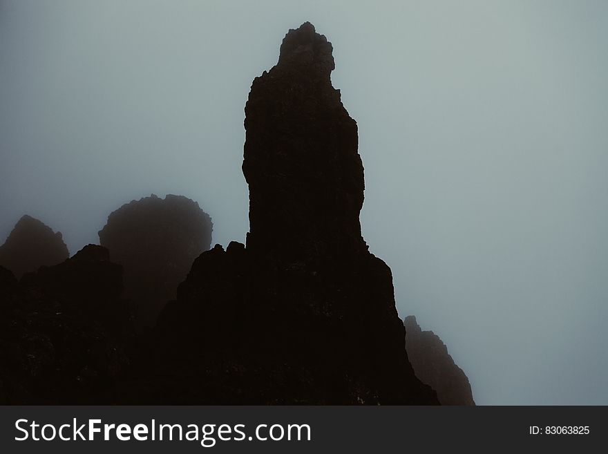 Rock stack on misty mountainside
