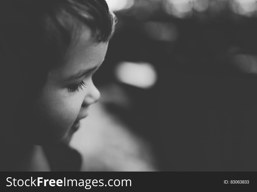 Profile portrait of child outdoors in black and white. Profile portrait of child outdoors in black and white.