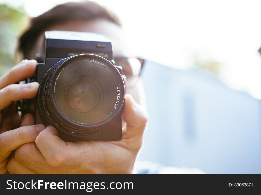 Boy Taking Picture With Bronica Camera