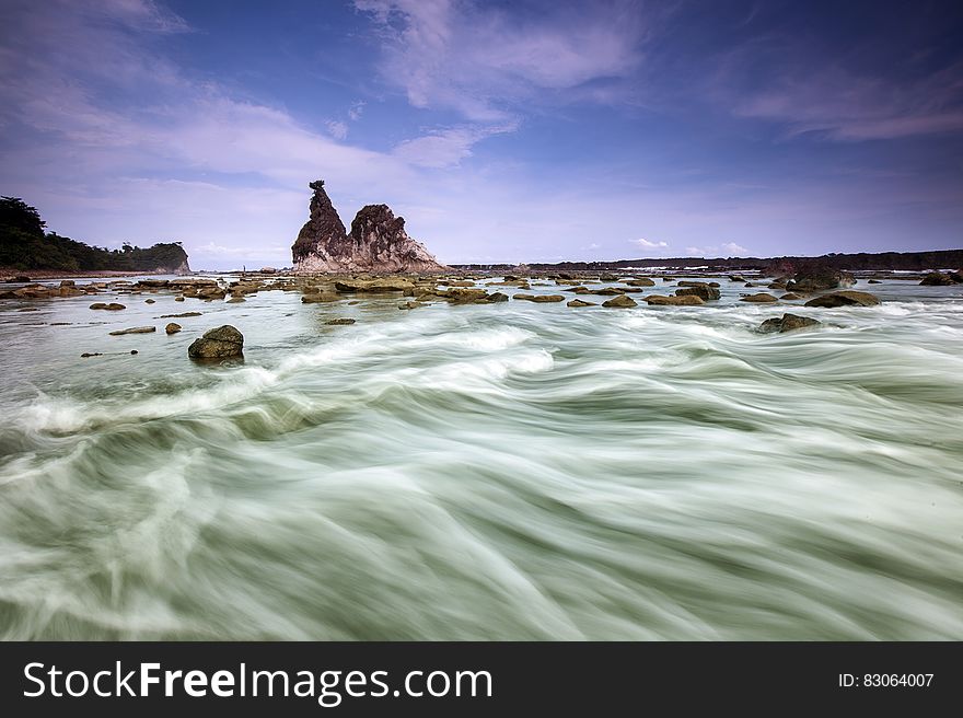 White Clouds over Rocky Isle Time Lapse Photography