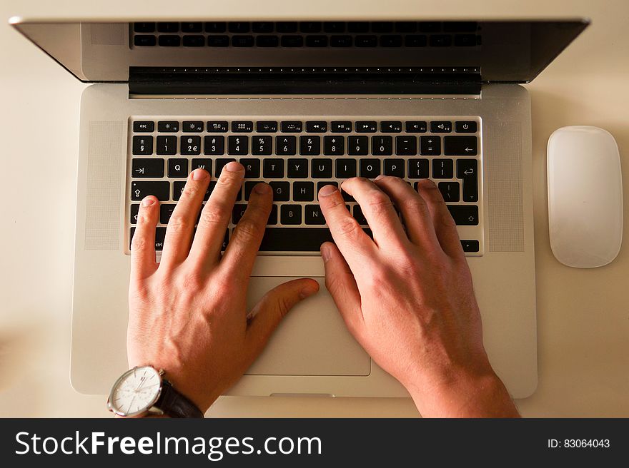 Person Typing On Laptop Computer
