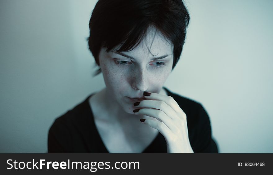 Woman Hands on Her Lips in Black Top