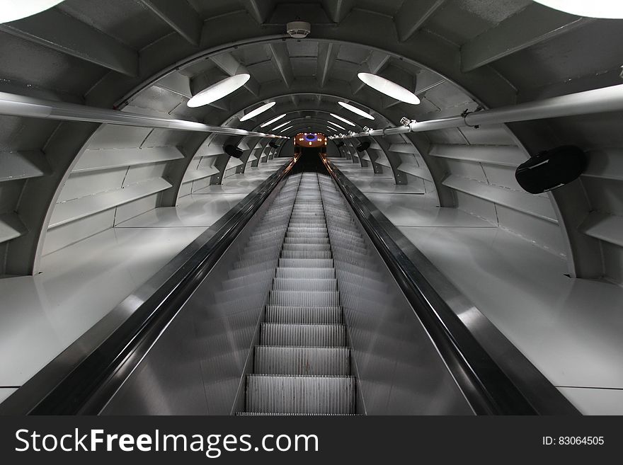 An escalator in a tunnel. An escalator in a tunnel.