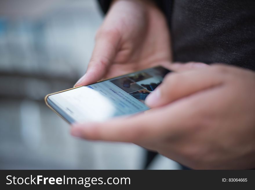 Person Using Smartphone Shallow Focus Photography