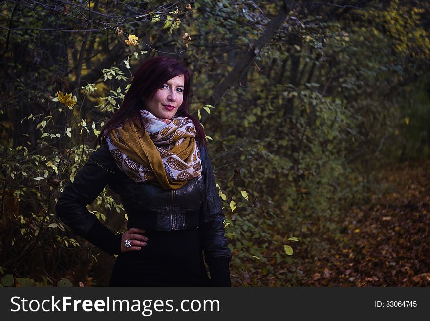Woman in Black Leather Jacket Beside Trees