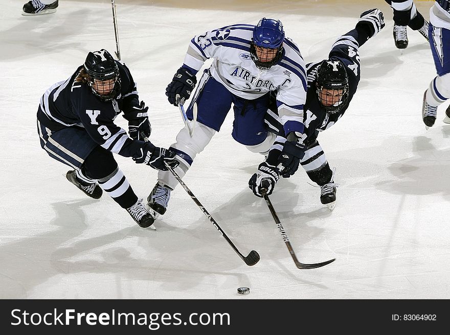 Men&#x27;s in Blue and White Jersey Shirt Playing Hockey