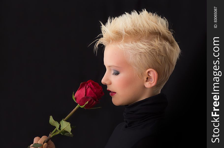 Woman Holding Red Rose
