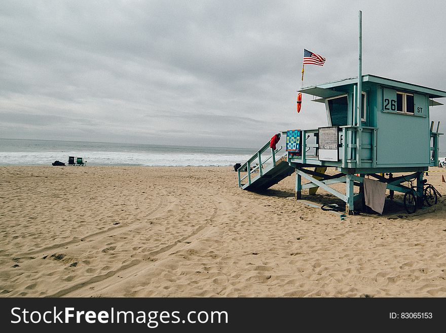 Wooden lifeguard shack on sandy beach. Wooden lifeguard shack on sandy beach.