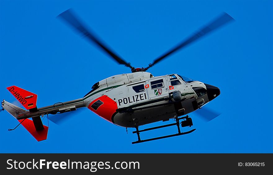 Photography of Red White and Blue Helicopter