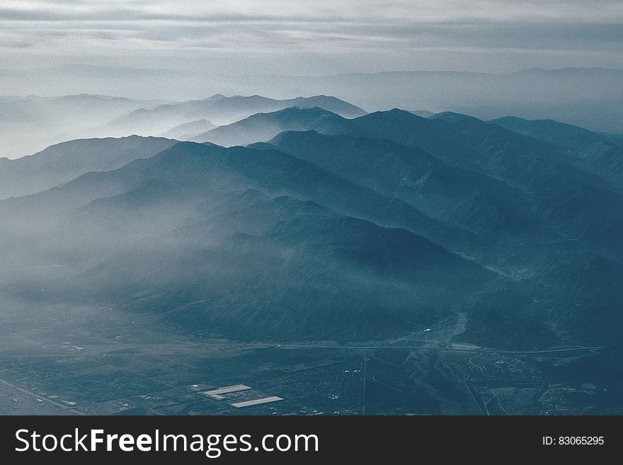 Scenic view of foggy mountainous landscape.