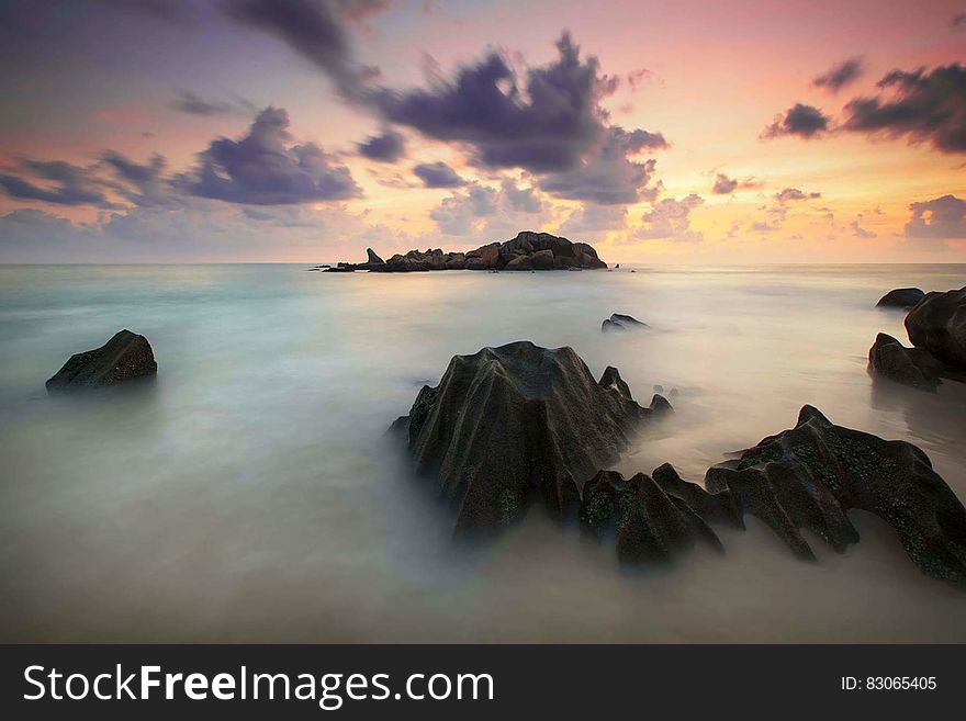 Time Lapse Photography Of High Rise Mountain Covered With Clouds