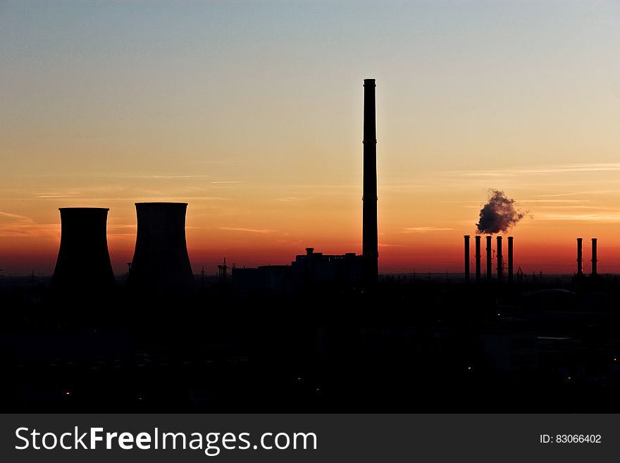 Silhouette Photo of Factory during Dusk