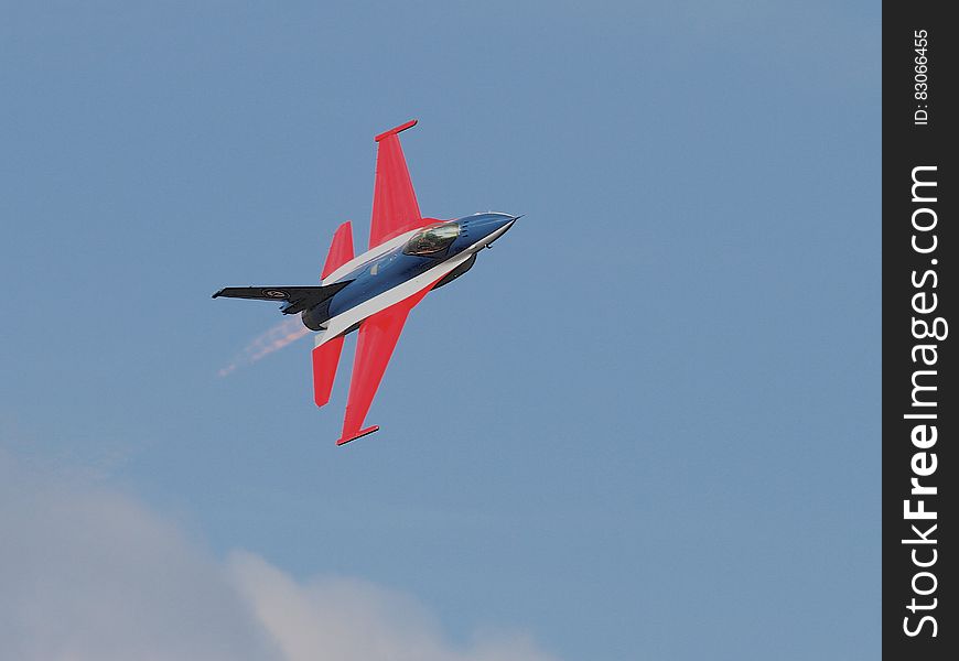 Blue Red Black and White Jet Plane on Air