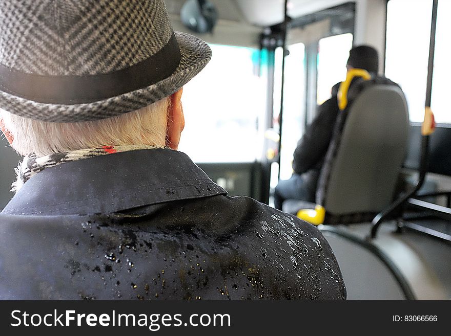 Man Wearing Black Coat While Wet
