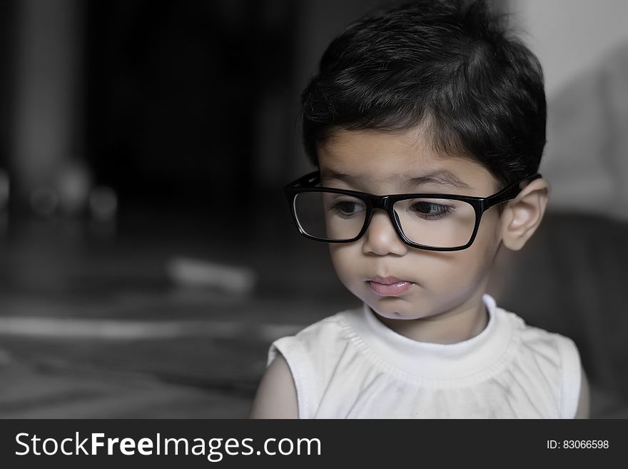 Portrait of young girl indoors wearing glasses. Portrait of young girl indoors wearing glasses.