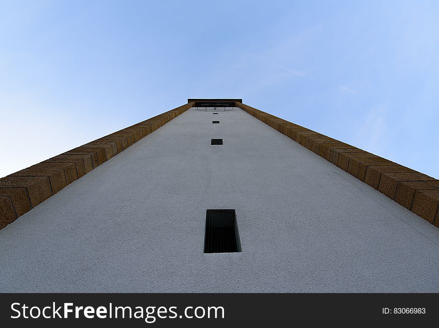 White And Black Concrete Building During Day Time