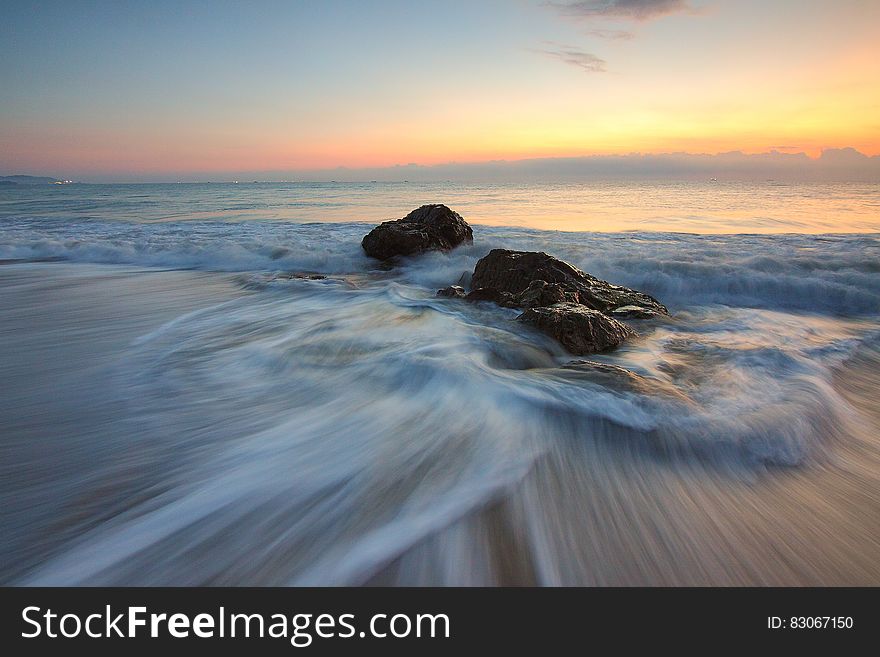 Time Lapse Photography Of Sea Wave On Seashore During Daytime