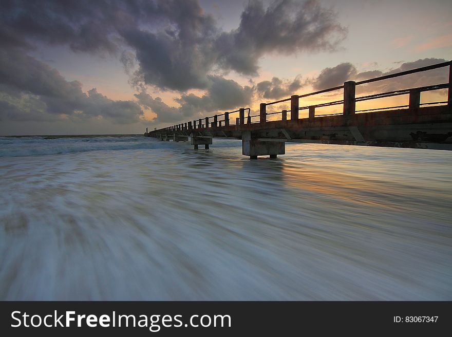 Brown Wooden Fishing Dock on Ocean