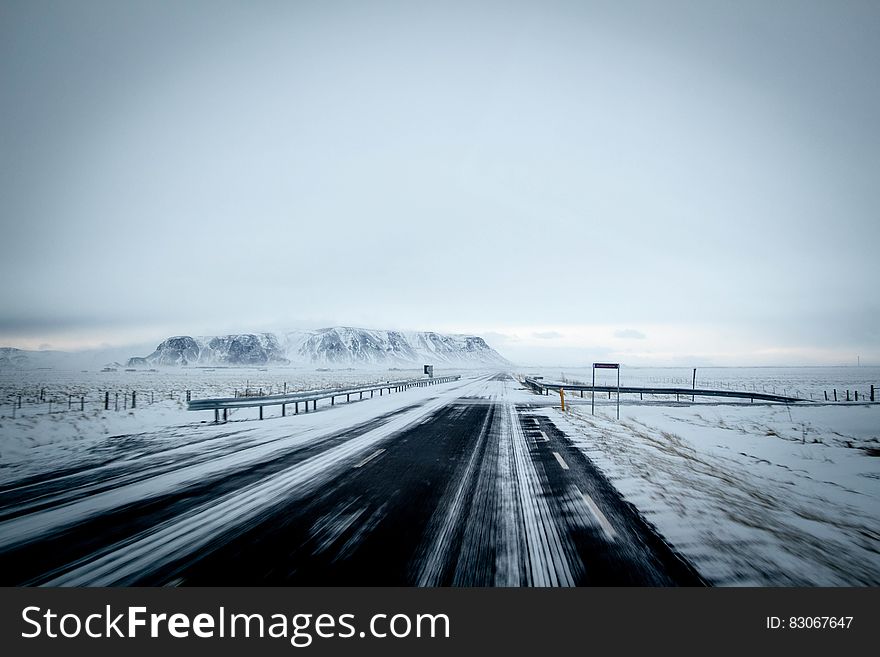 Winter landscape with a road passing through. Winter landscape with a road passing through.