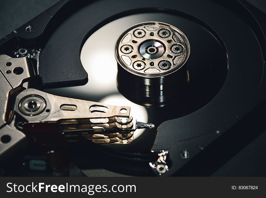 Close up of mechanism inside computer hard drive.