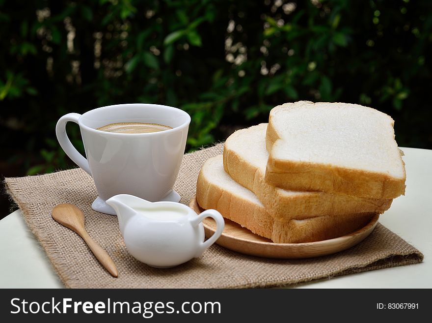 3 Sliced Loafs Beside White Ceramic Coffee Cup