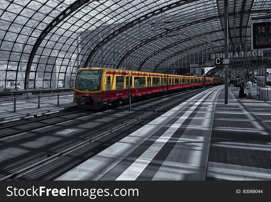 Yellow Train on Railway during Daytime