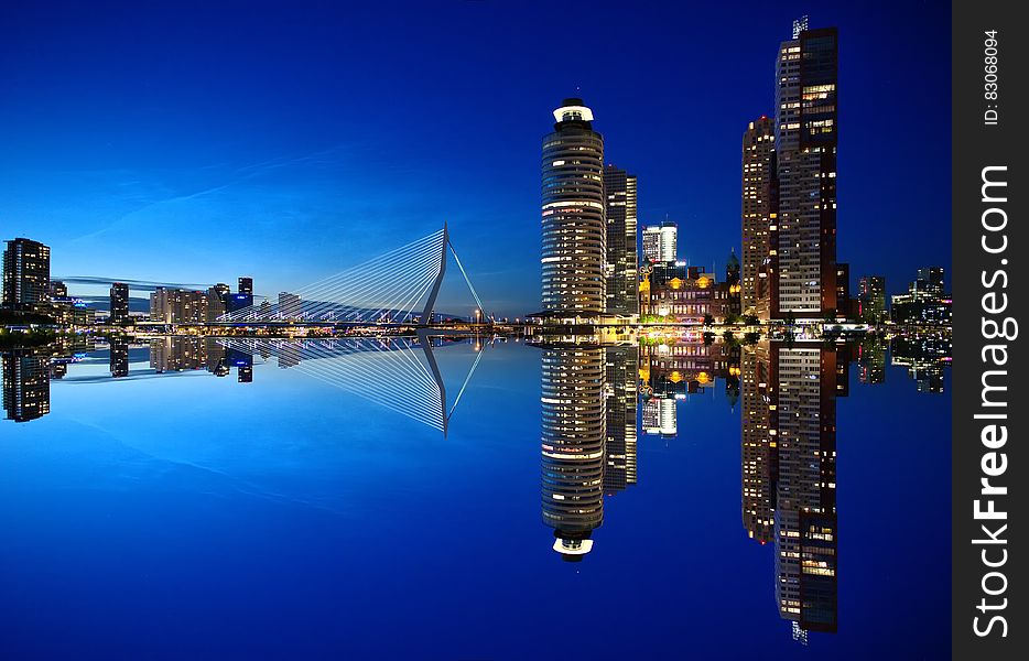 Mirrored Image of High Rise Buildings and Bridge
