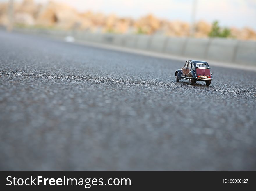 Citroen toy car on pavement on sunny day. Citroen toy car on pavement on sunny day.