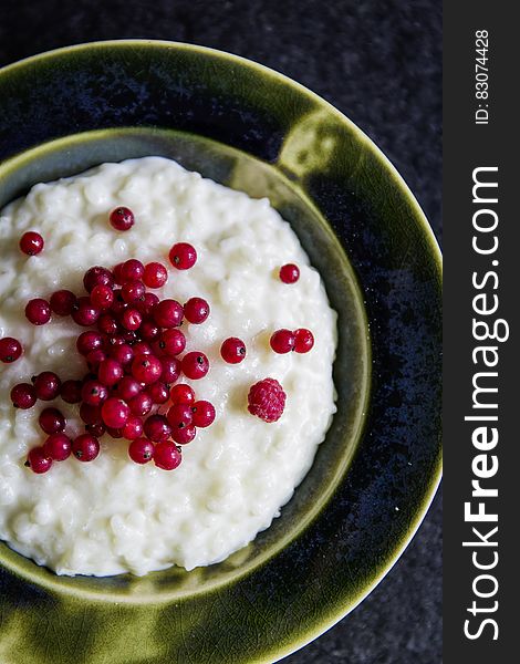 Red Cherry On White Soup Dish In Brown Plate