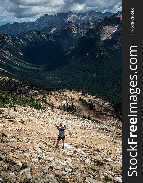 Hiker on rocky hillside