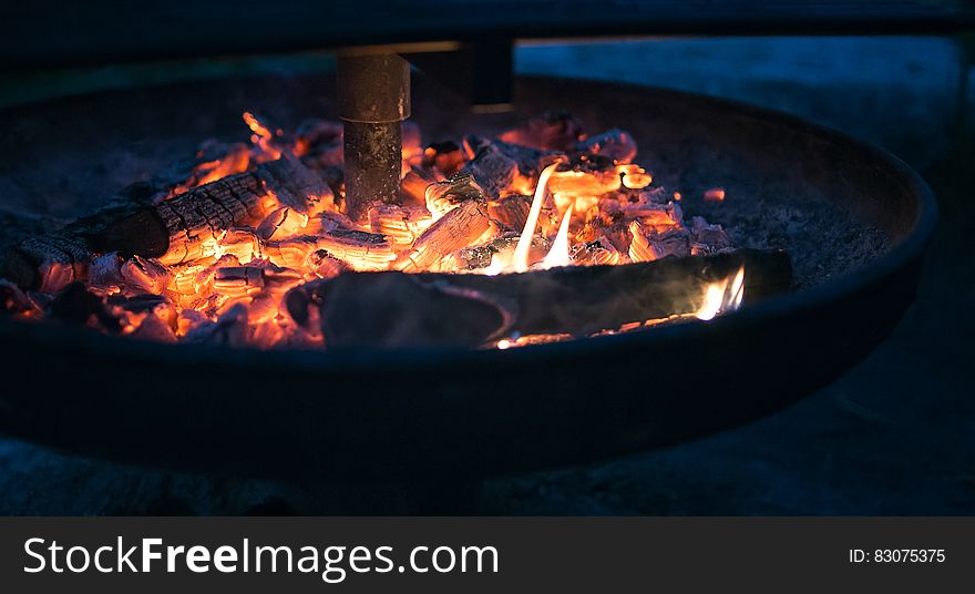 Round Fire Pit With Burning Wood