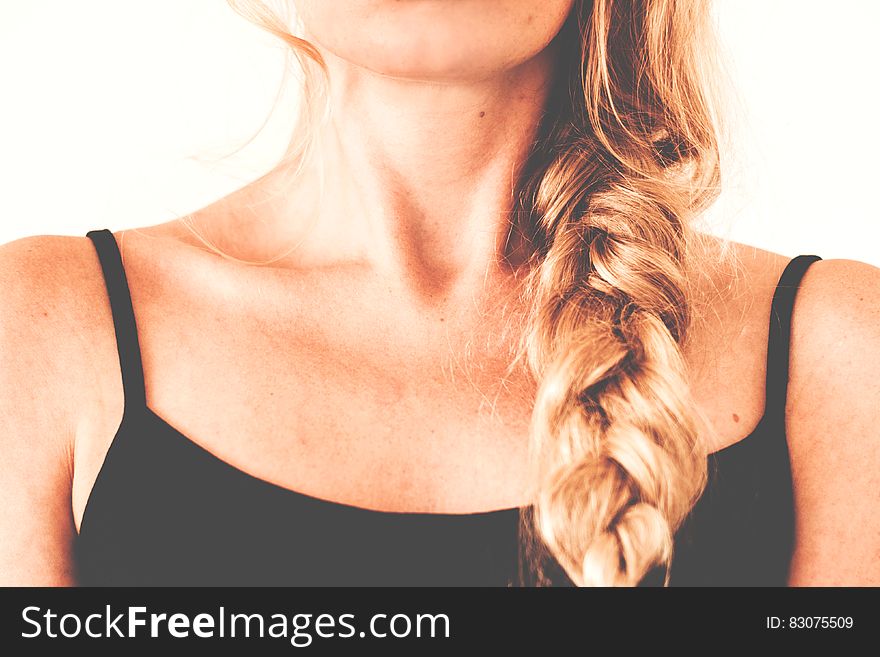 Woman in Black Tank Top With Braided Hair