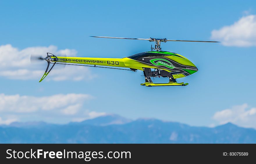 Green Black and Yellow Heli Division 630 Helicopter
