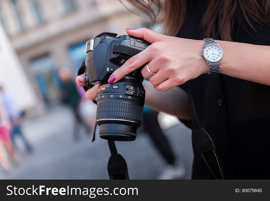 Woman Holding Black Dslr Camera