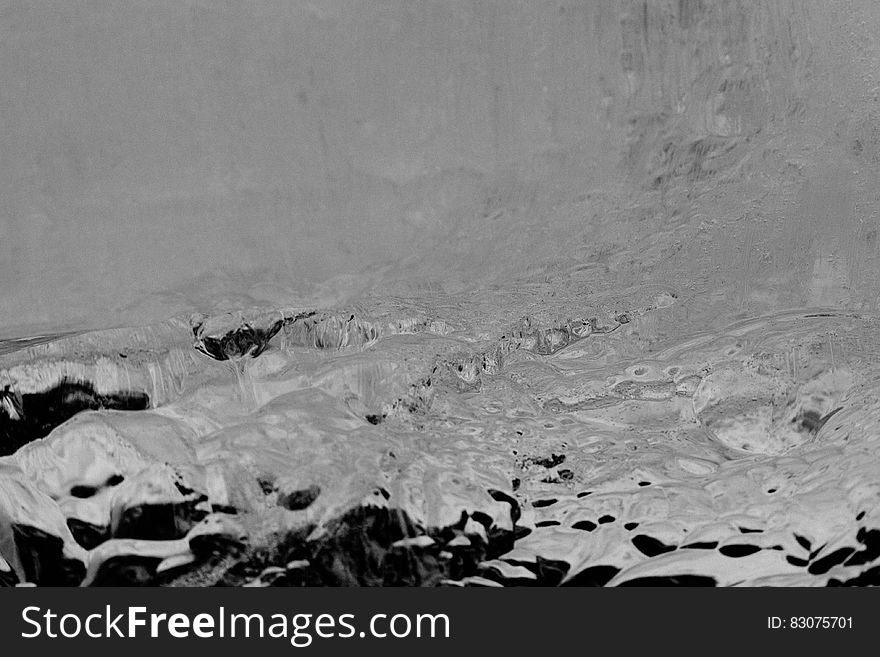 Melting snow on rocky landscape in black and white. Melting snow on rocky landscape in black and white.