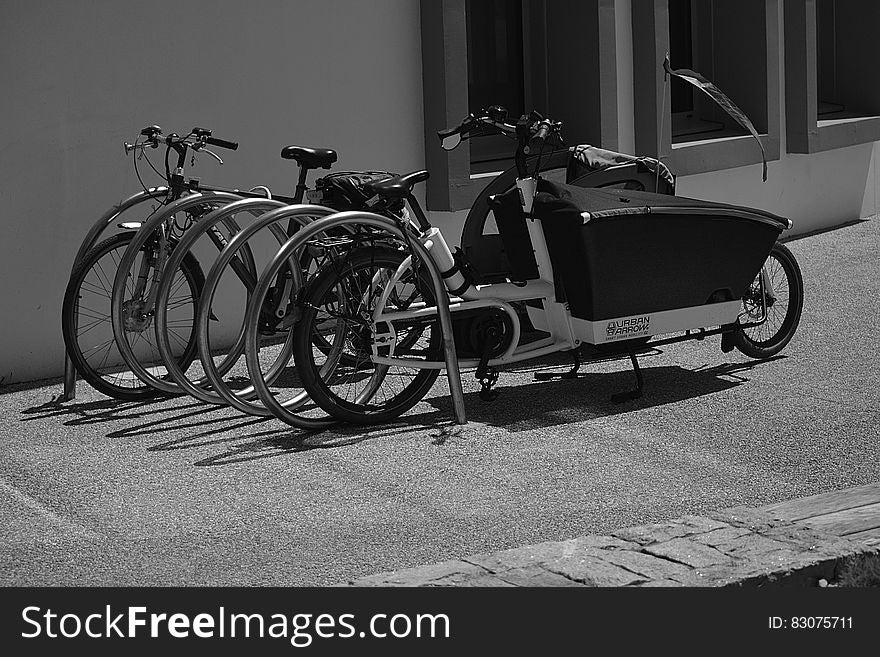 Greyscale Photo of Utility Bike during Daytime