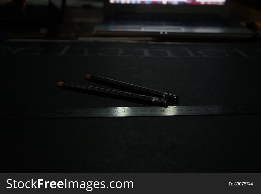 Black Pencil Near Grey Steel Ruler