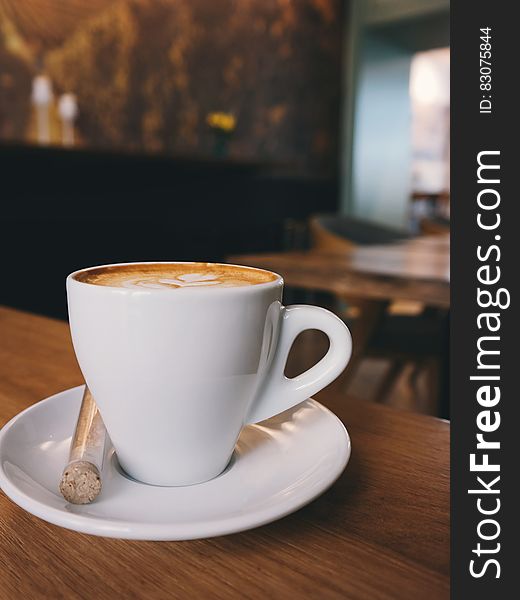 White Ceramic Cup on White Ceramic Saucer With White Espresso Coffe