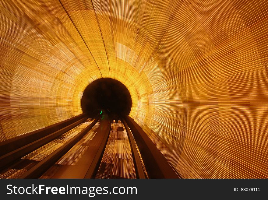 A long exposure of a brightly lit tunnel.