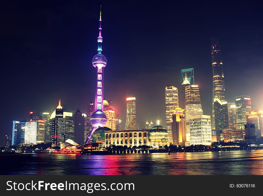 Shanghai city skyline at night on the Pudong, China.