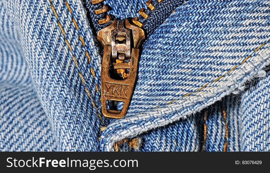A close up of a zipper in jeans. A close up of a zipper in jeans.