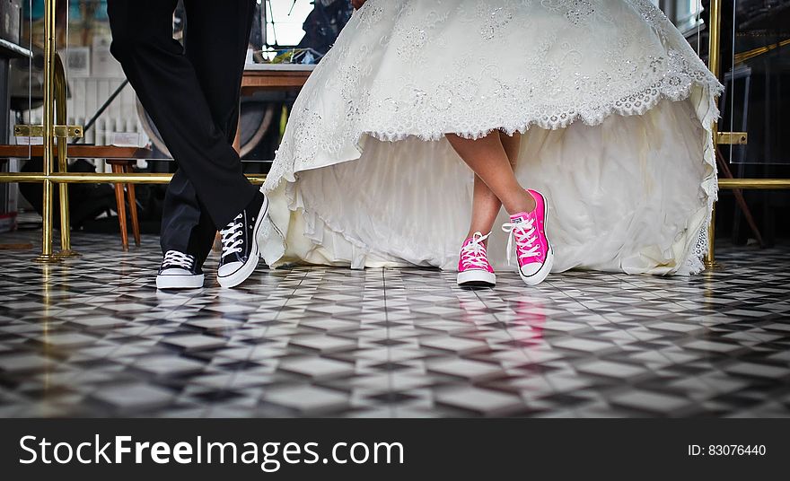 Woman Wearing Pink and White Low Top Shoes Dancing Beside Man