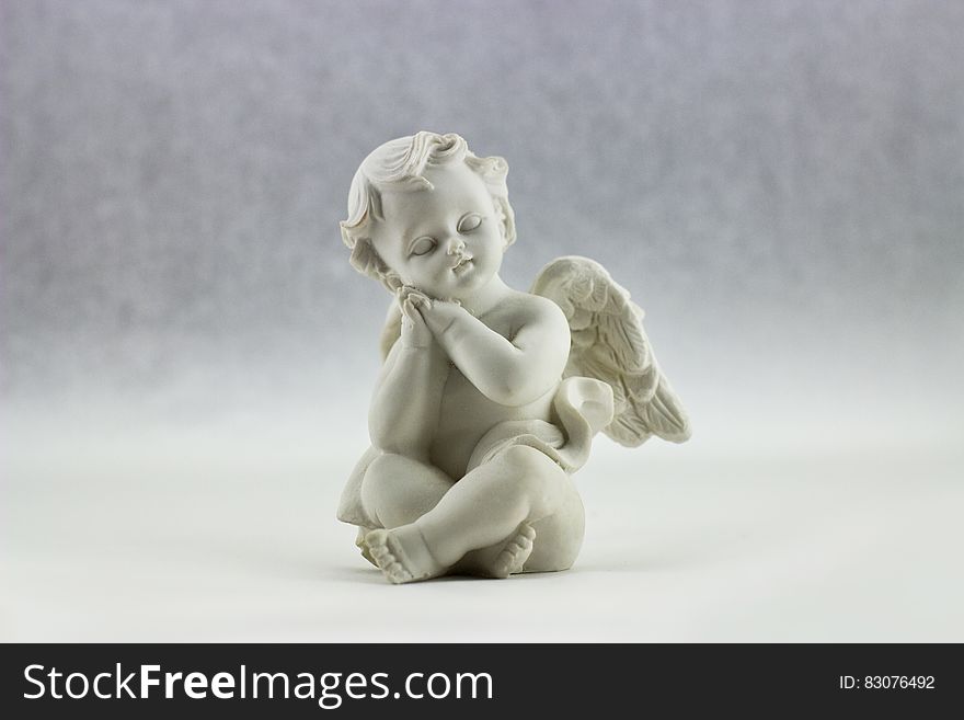 White Ceramic Figurine Of Angel Illustration