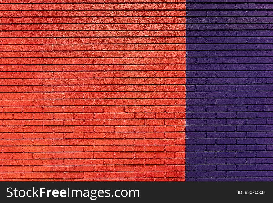 A red and dark blue brick wall. A red and dark blue brick wall.