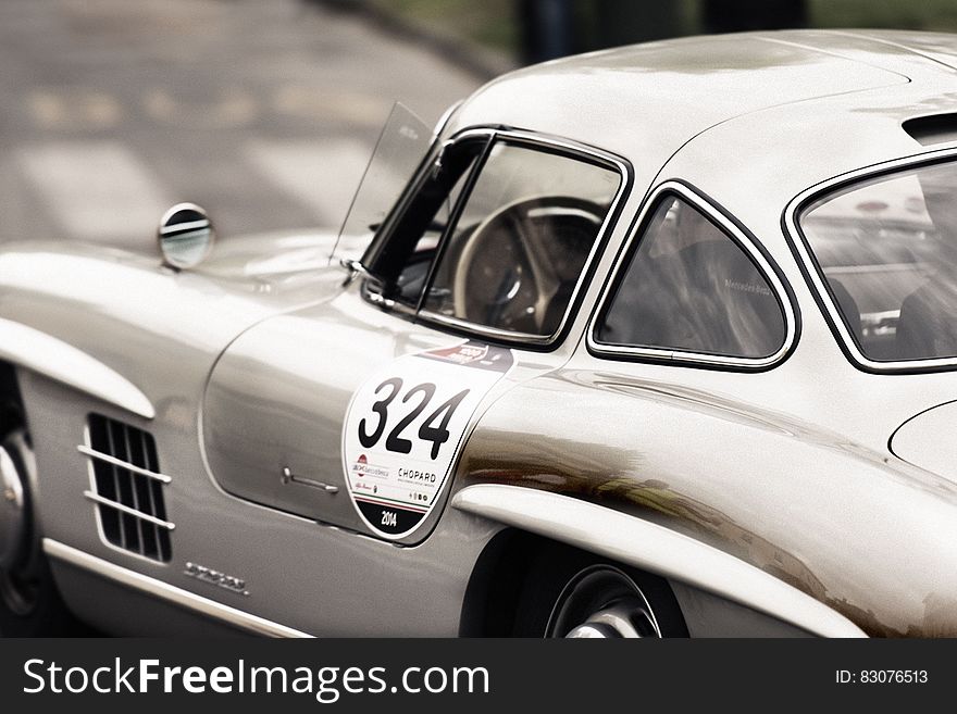 White and Gray Vintage Sports Car