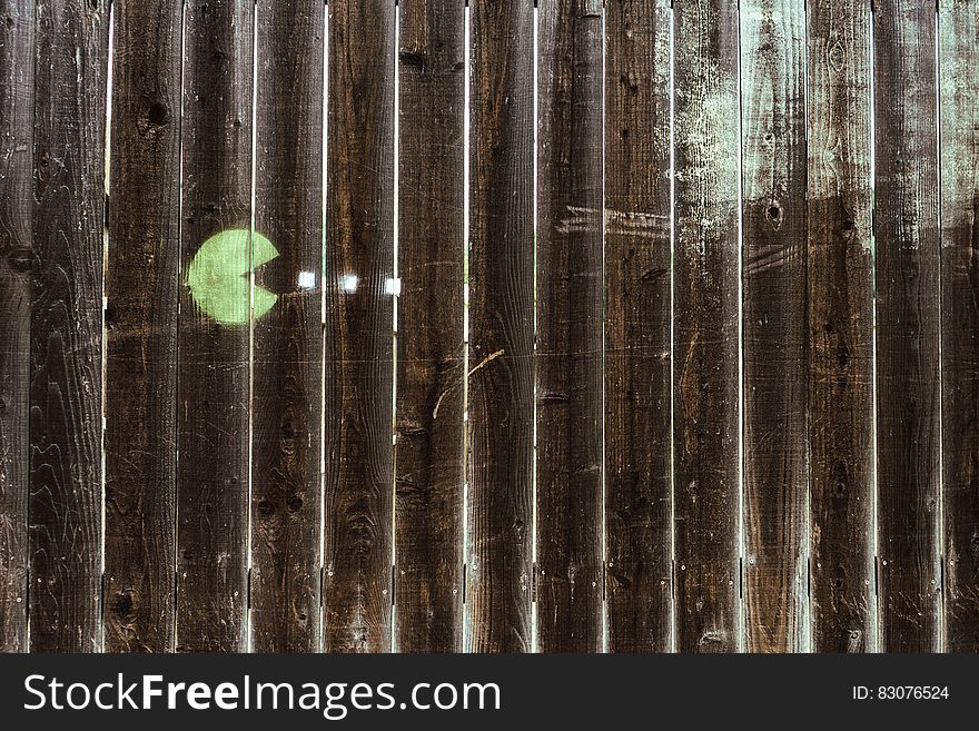 Pacman drawing on wooden fence