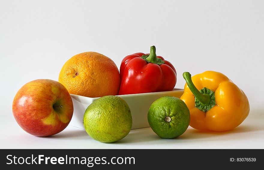 Red Apple Fruit Near Red Bell Pepper