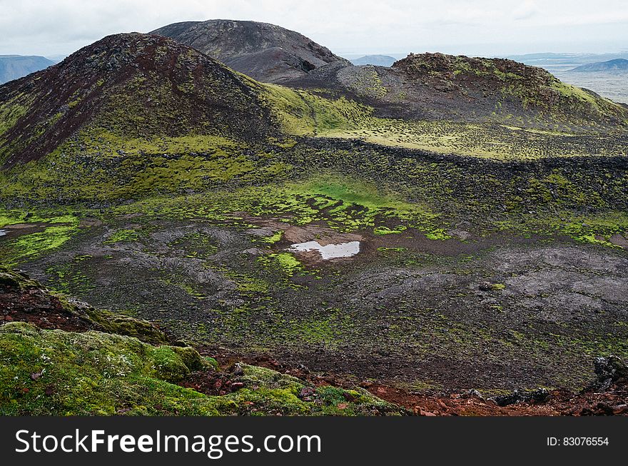 Hills and a a bog in a valley covered in moss. Hills and a a bog in a valley covered in moss.